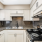 a kitchen with white cabinets