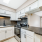 a kitchen with white cabinets