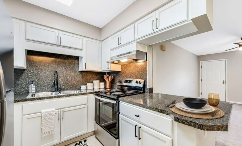 Retreat at Kannapolis Apartments – Renovated Kitchen with Granite-Style Countertops