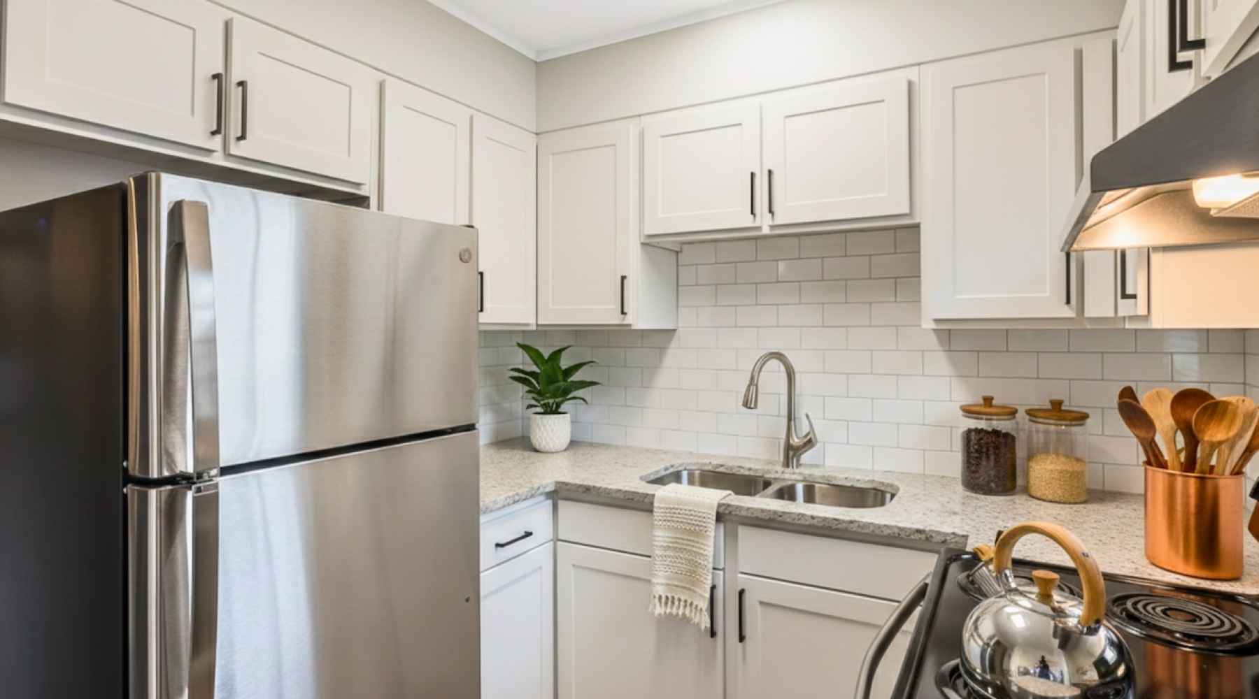 Renovated Kitchen with fridge and stove at Retreat at Kannapolis