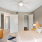 a bedroom with a ceiling fan and a bed
