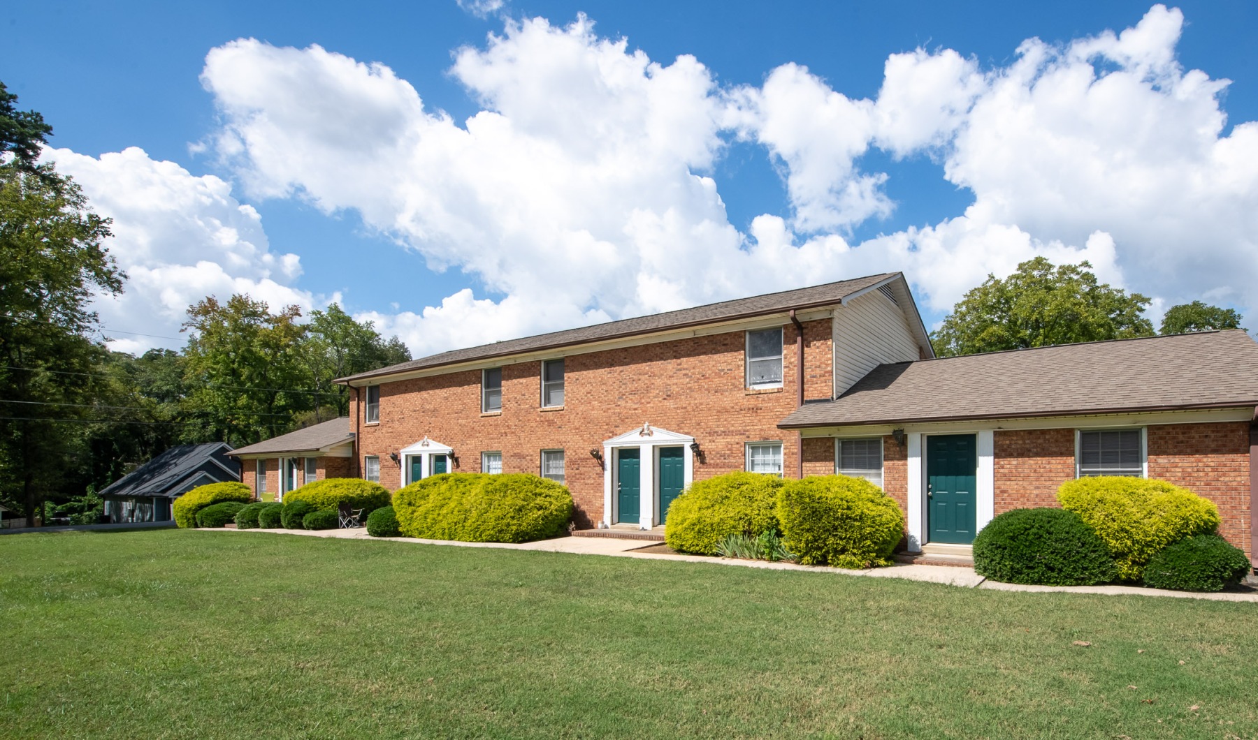 Brick building with green lawn