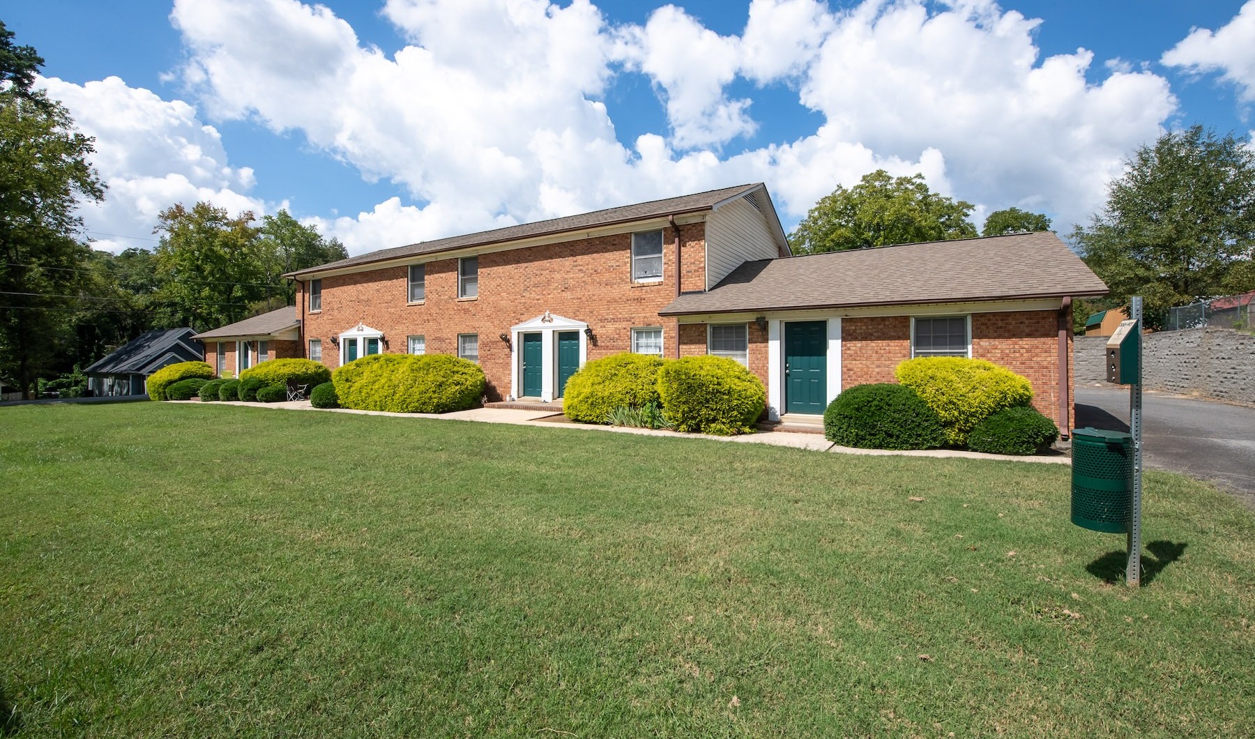 Brick building with green lawn