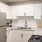 a kitchen with white cabinets