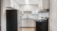 a kitchen with white cabinets