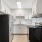 a kitchen with white cabinets