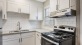 a kitchen with white cabinets