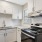 a kitchen with white cabinets