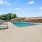 Swimming Pool with brick building backdrop