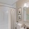a bathroom with a white shower curtain